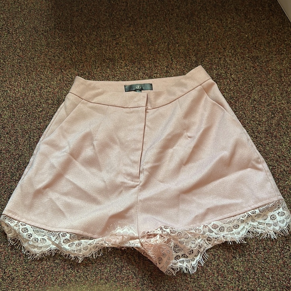 Medium, size 2. Pink shorts with laceline on the bottom.